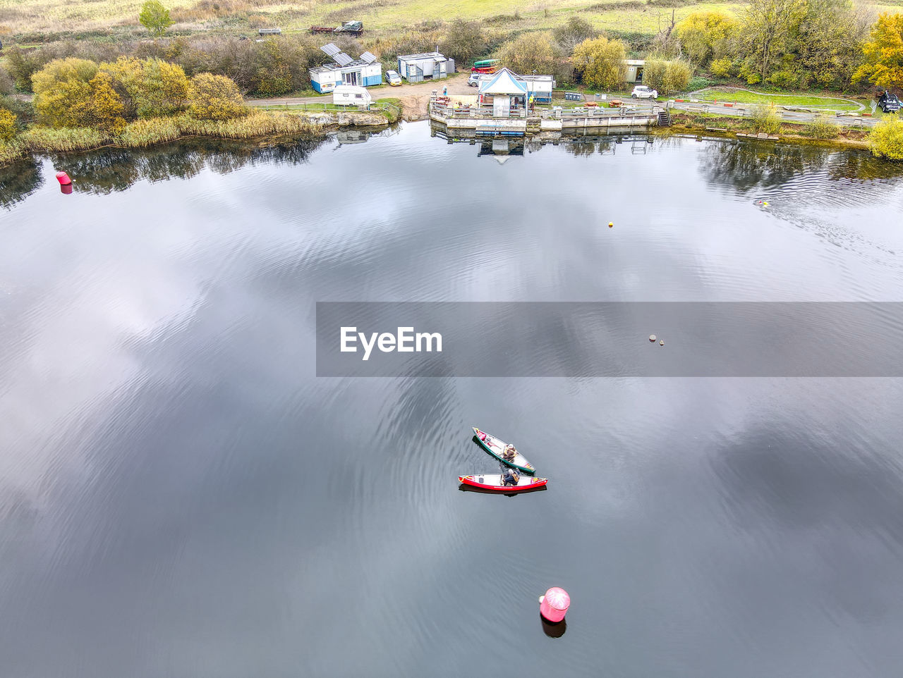 HIGH ANGLE VIEW OF PEOPLE ON LAKE