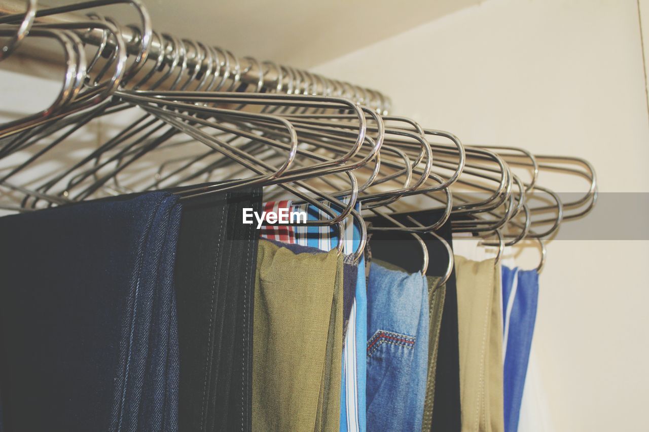 Close-up of clothes hanging on rack