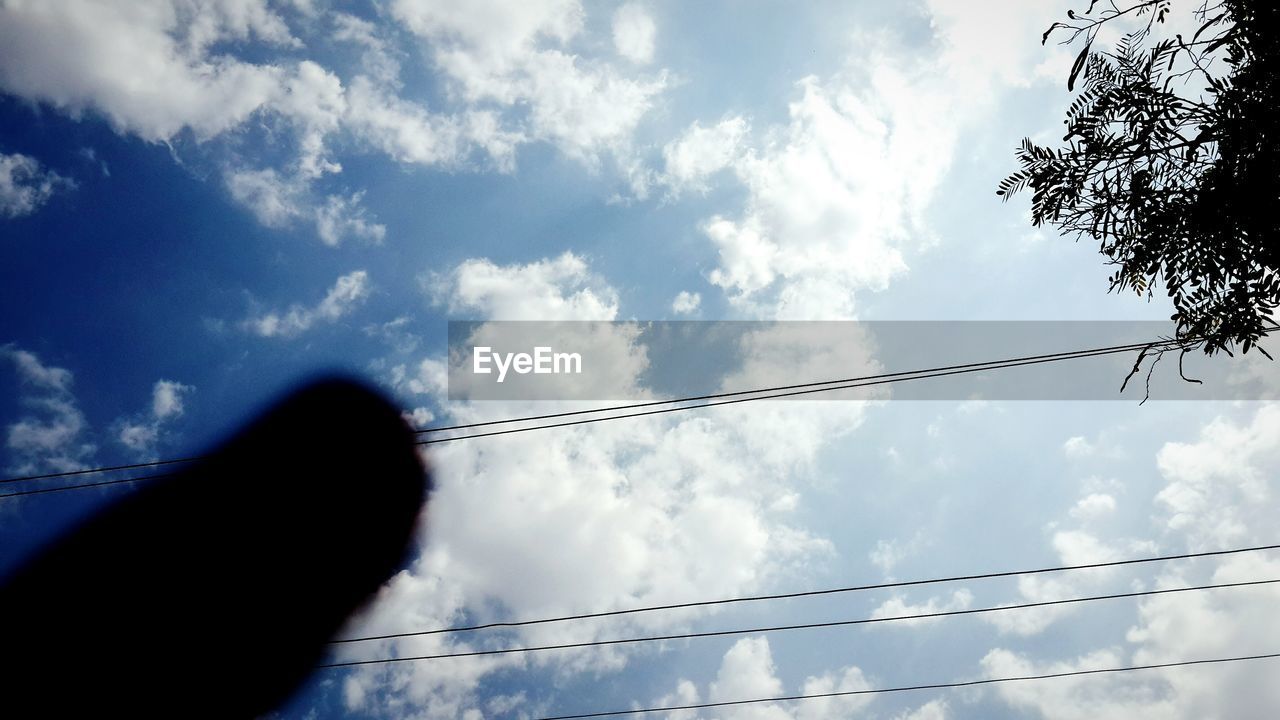 LOW ANGLE VIEW OF POWER LINES AGAINST CLOUDY SKY