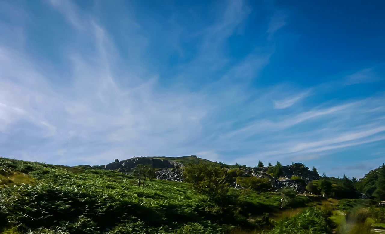 Low angle view of mountain against sky during sunny day