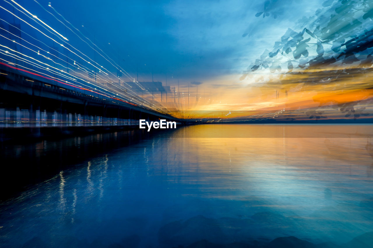 SCENIC VIEW OF BRIDGE AGAINST SKY DURING SUNSET