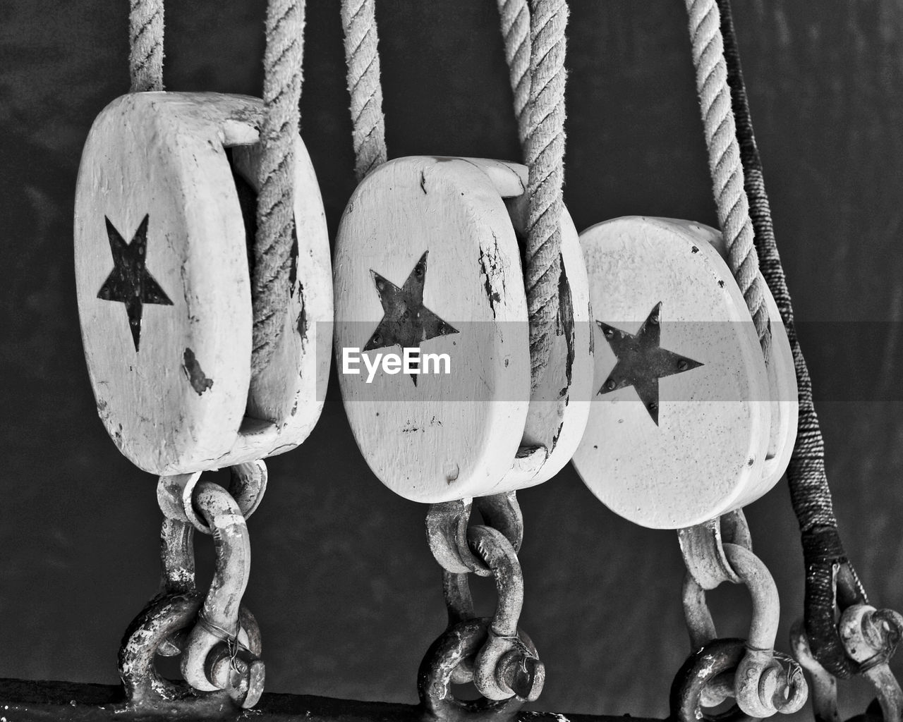 Close-up of star shape on ship pulleys