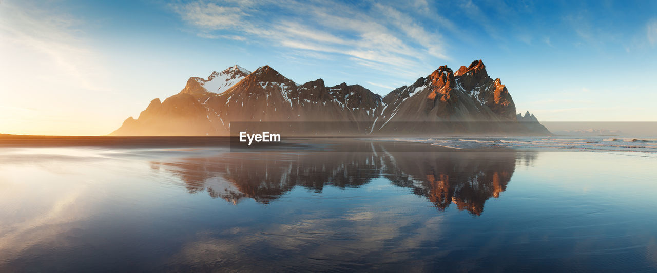 PANORAMIC VIEW OF SEA AGAINST SKY AT SUNSET