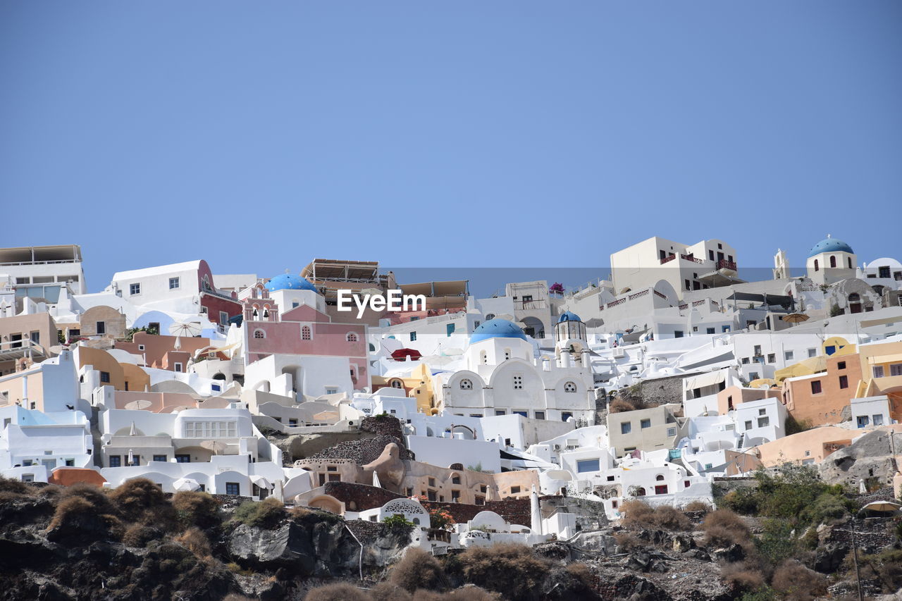 LOW ANGLE VIEW OF BUILDINGS AGAINST CLEAR SKY