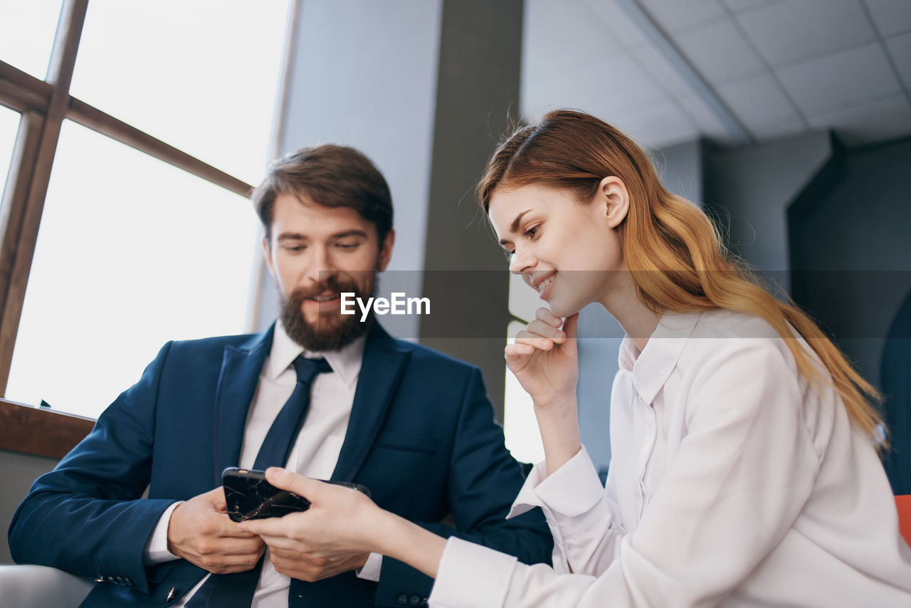 Young couple looking at camera