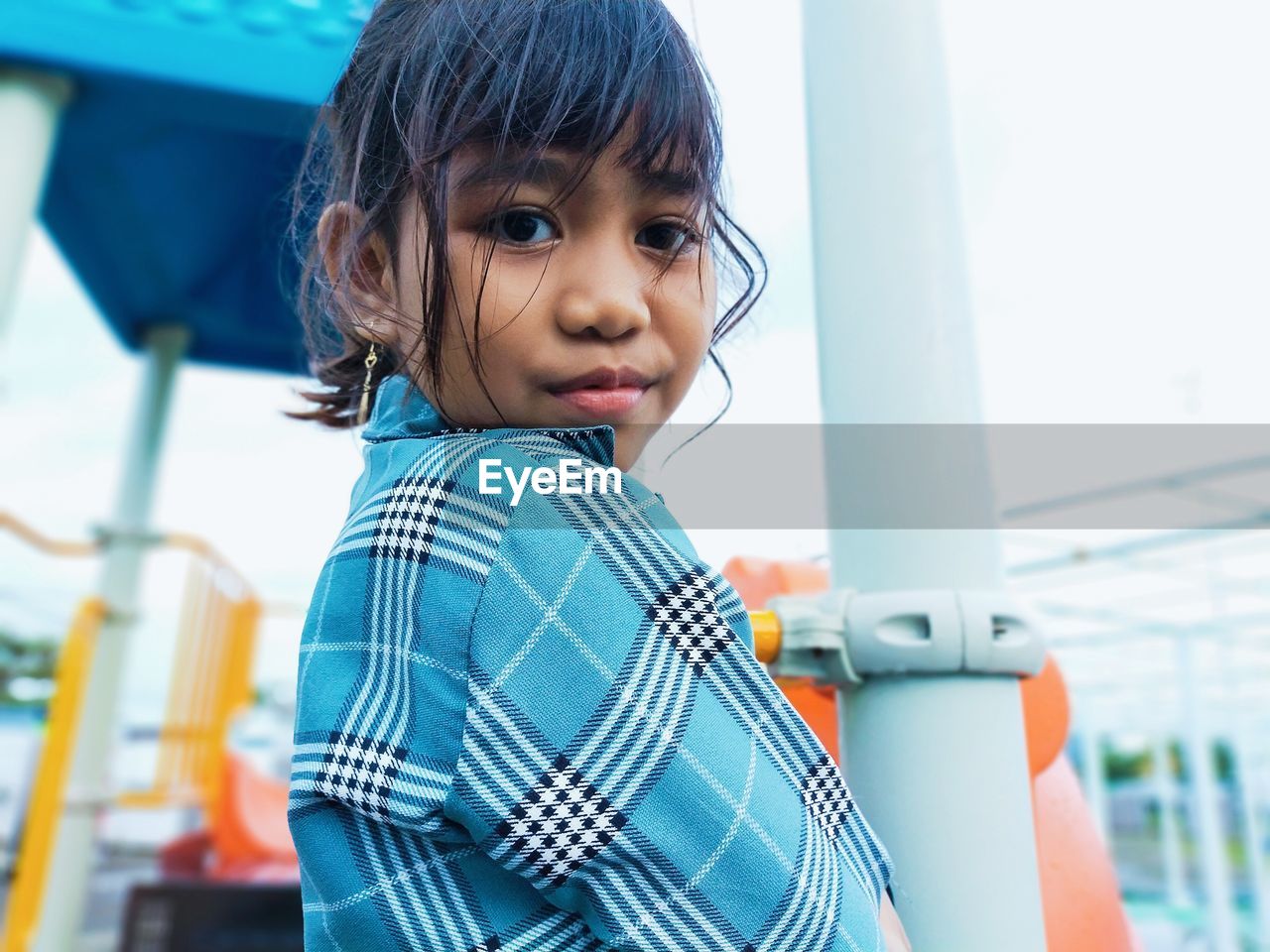 Portrait of cute girl looking at camera