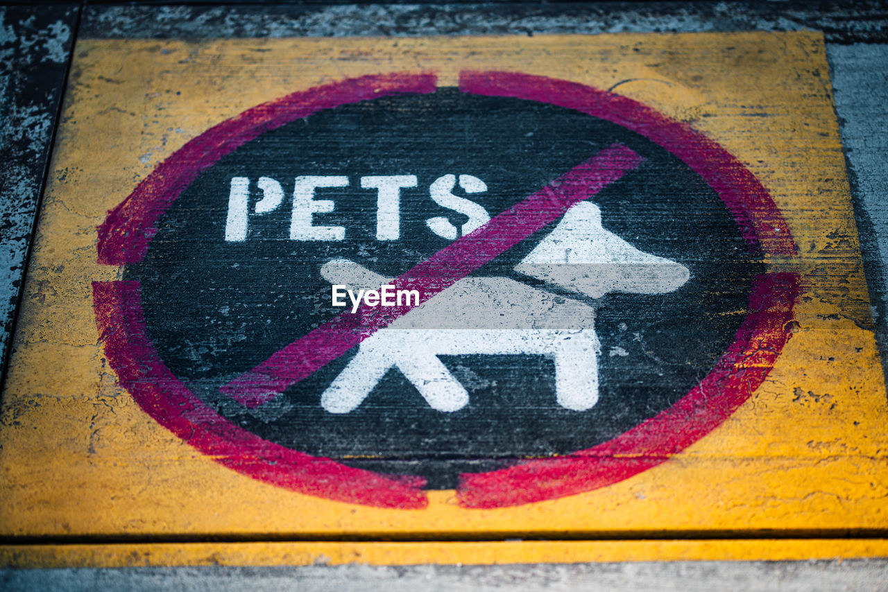 Close-up of sign on road