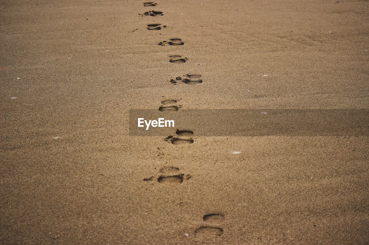 FOOTPRINTS ON BEACH