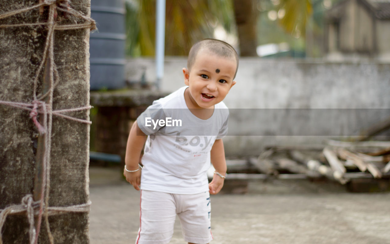 childhood, child, one person, spring, men, happiness, emotion, smiling, toddler, portrait, person, cute, casual clothing, baby, portrait photography, innocence, standing, looking at camera, cheerful, fun, nature, day, outdoors, lifestyles, front view, full length, teeth, smile