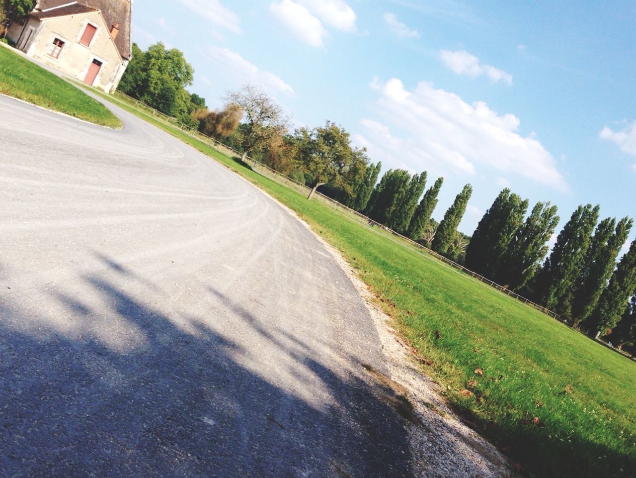 VIEW OF ROAD AGAINST CLOUDY SKY