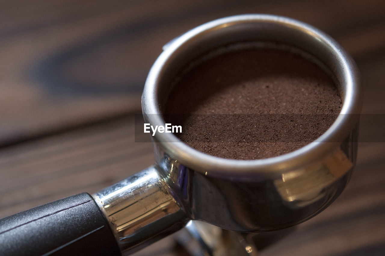 Close-up of ground coffee in serving scoop