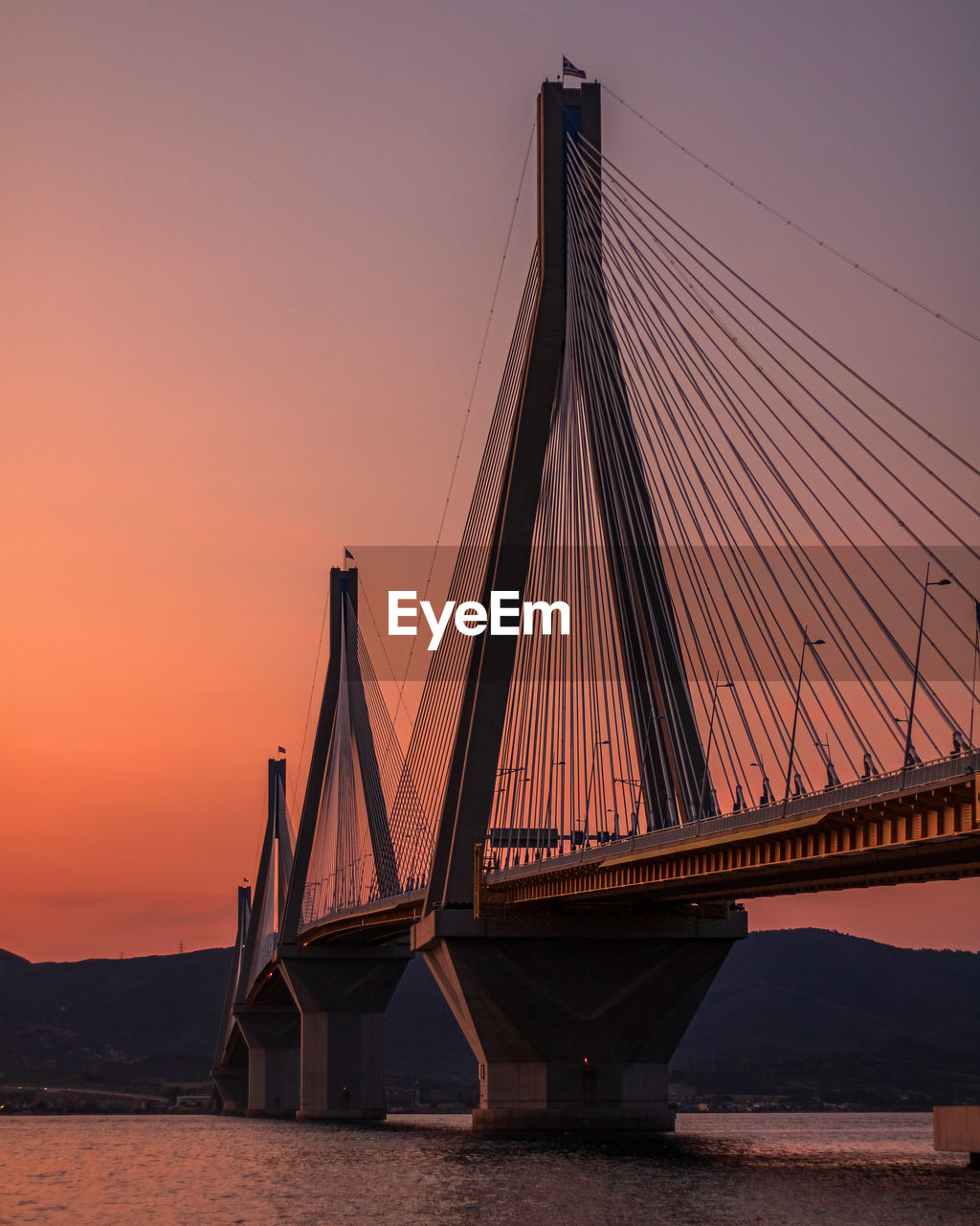 View of suspension bridge against sky during sunset