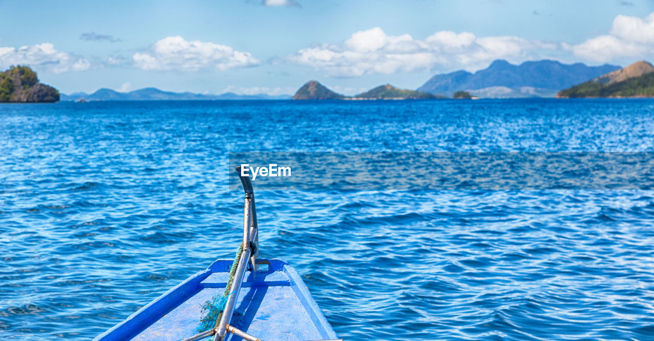 SAILBOATS IN SEA AGAINST SKY