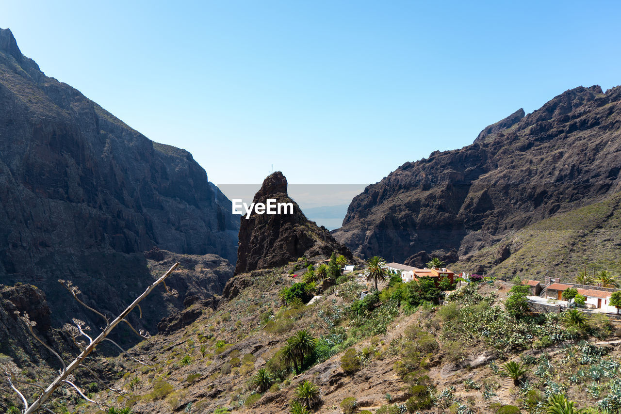 Scenic view of rocky mountains against clear sky