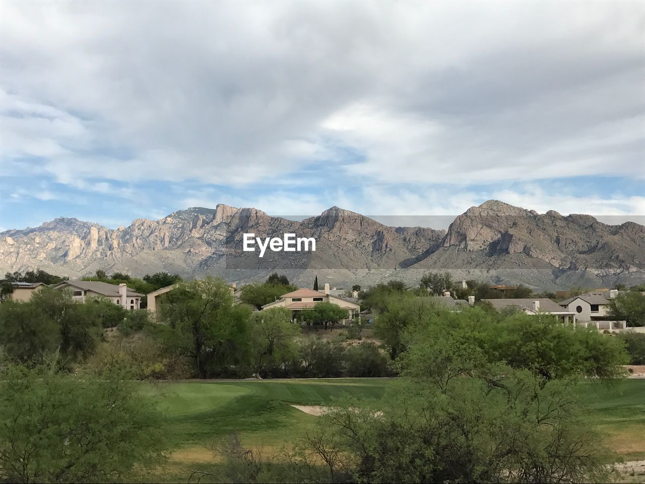 Scenic view of landscape and mountains against sky