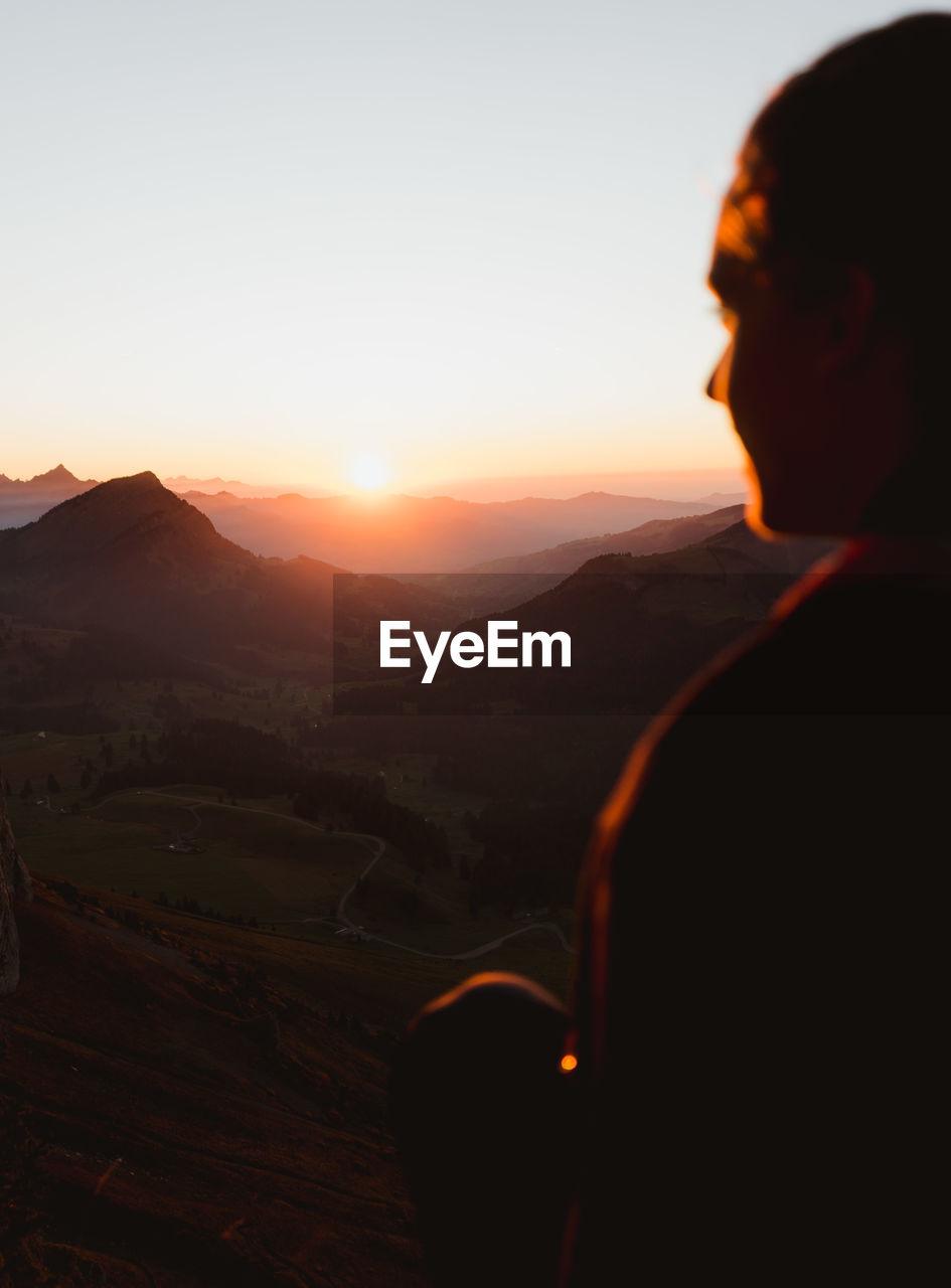 SCENIC VIEW OF MOUNTAINS AGAINST CLEAR SKY