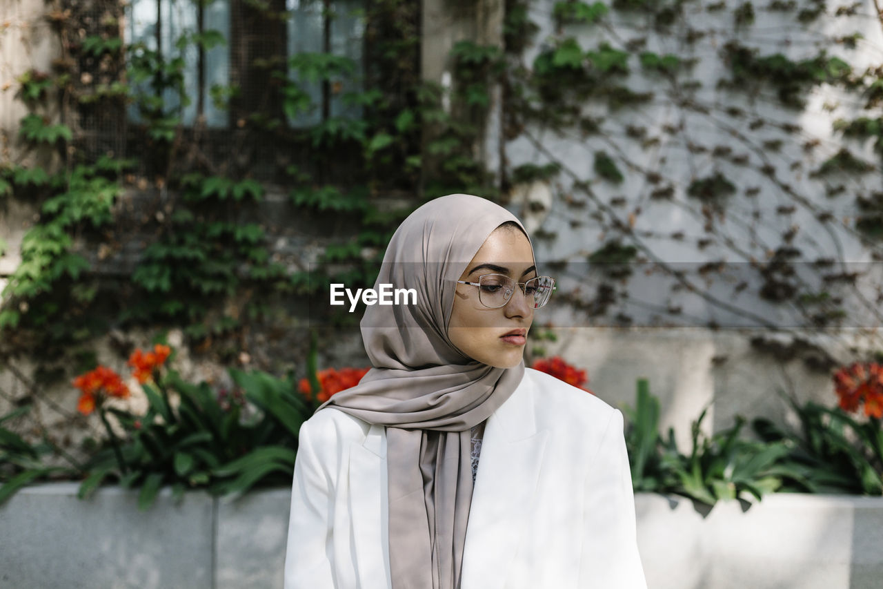 Woman wearing headscarf while standing outdoors