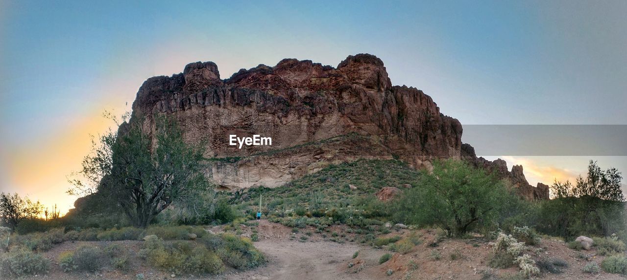 LOW ANGLE VIEW OF ROCK FORMATION ON MOUNTAIN AGAINST SKY