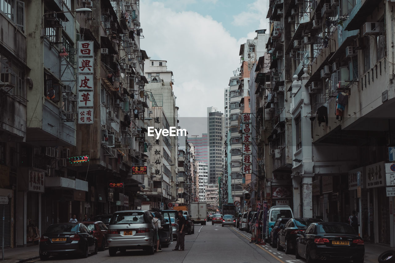 STREET AMIDST BUILDINGS IN CITY