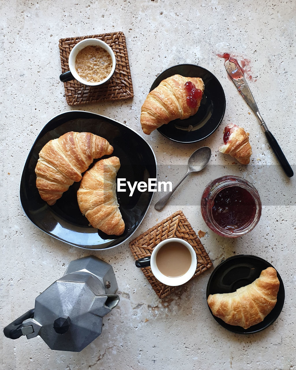 High angle view of coffee and croissants on stone table