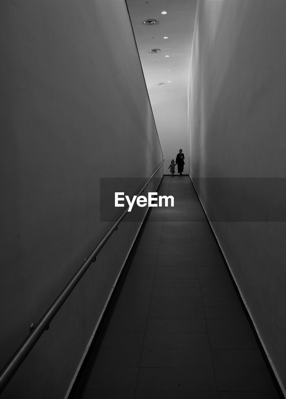 It's boarding time Entry EyeEm Accessories Architecture Built Structure Corridor Direction Eyemphotography Flooring Illuminated Indoors  Ramp Real People The Way Forward Walking Wall - Building Feature