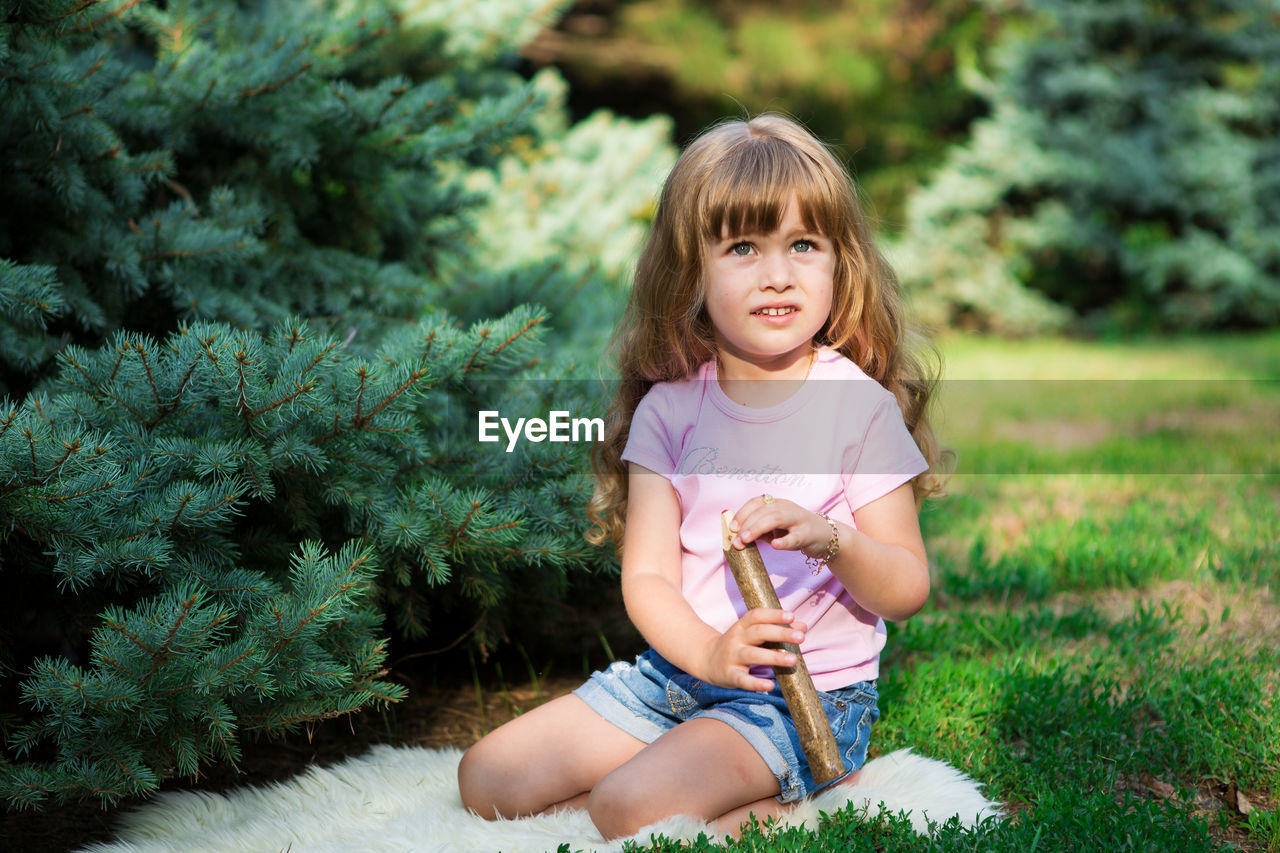 Portrait of a girl sitting on grass