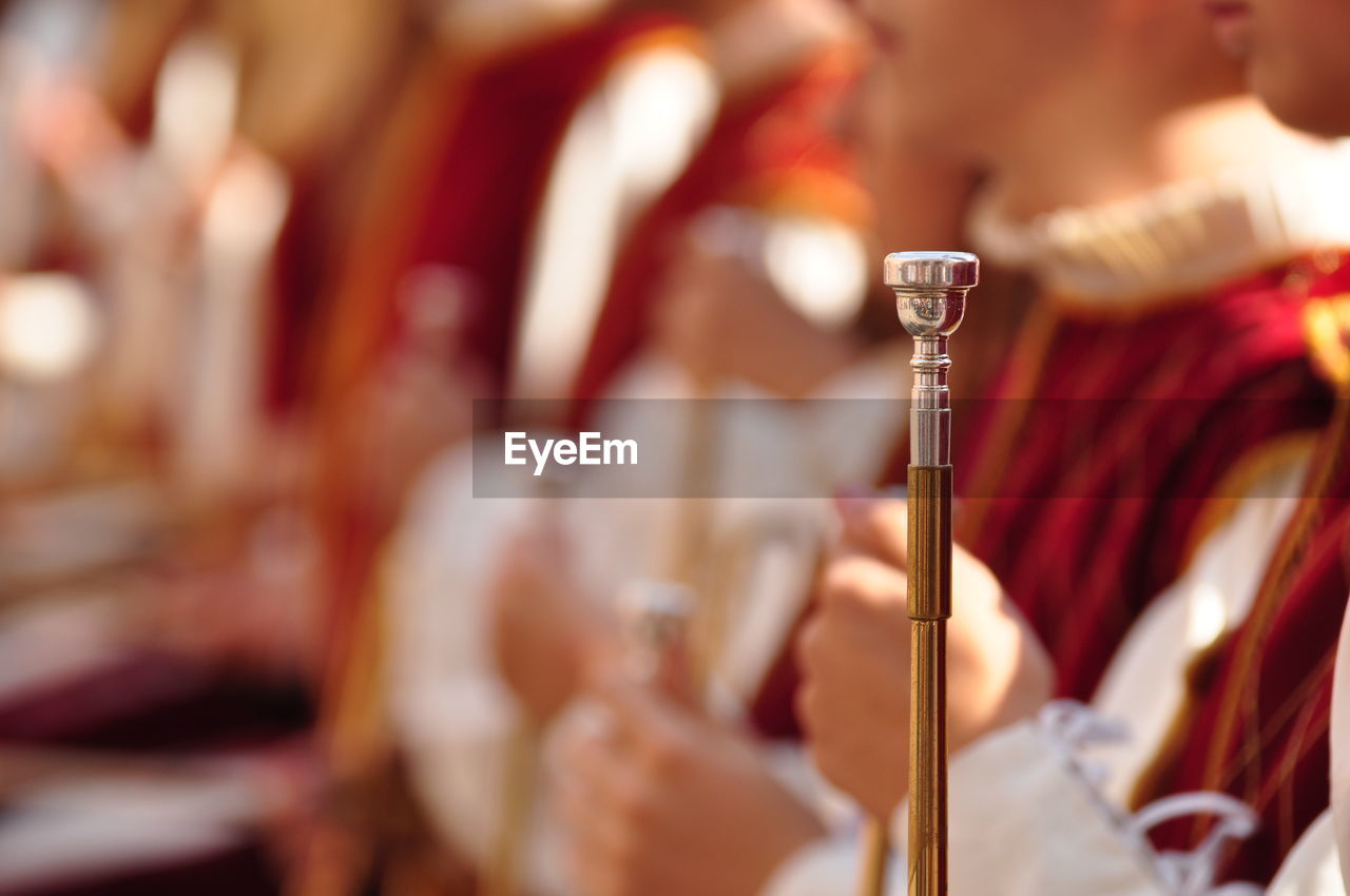 musical instrument, adult, selective focus, music, group of people, performance, indoors, focus on foreground, women, tradition, musician, ceremony, holding, celebration, arts culture and entertainment, close-up, religion, event