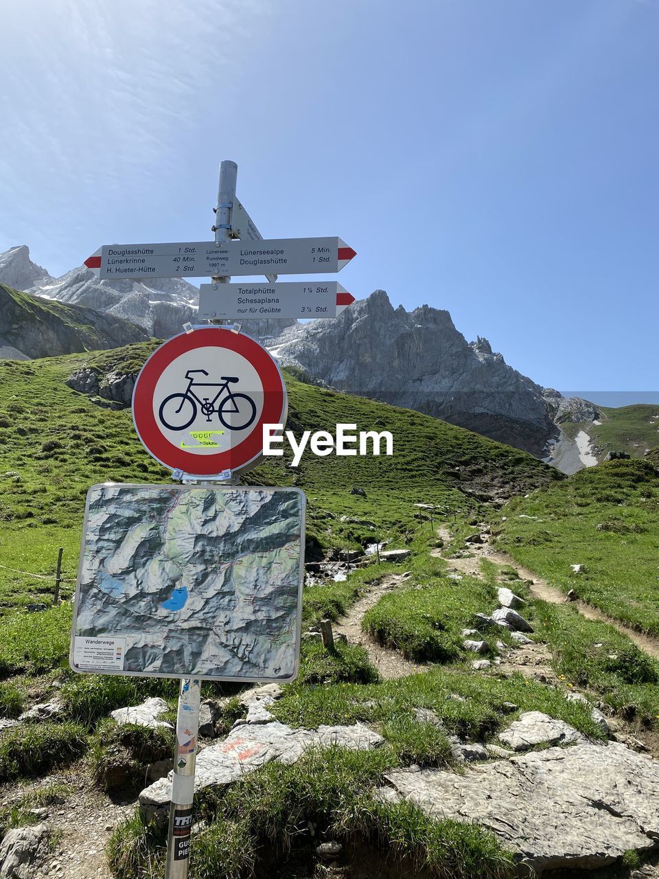 Low angle view of road sign against sky