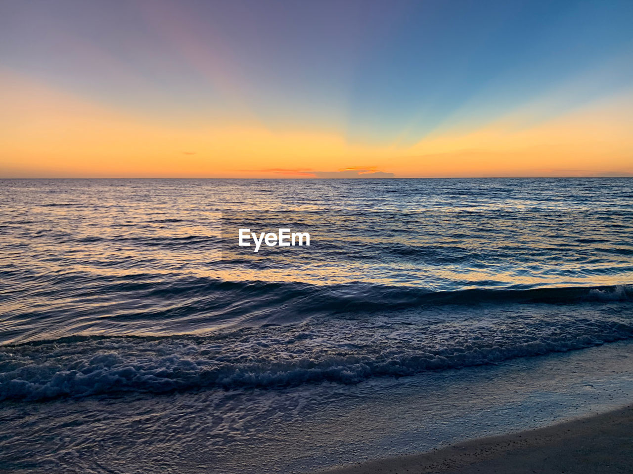 Scenic view of sea against sky during sunset