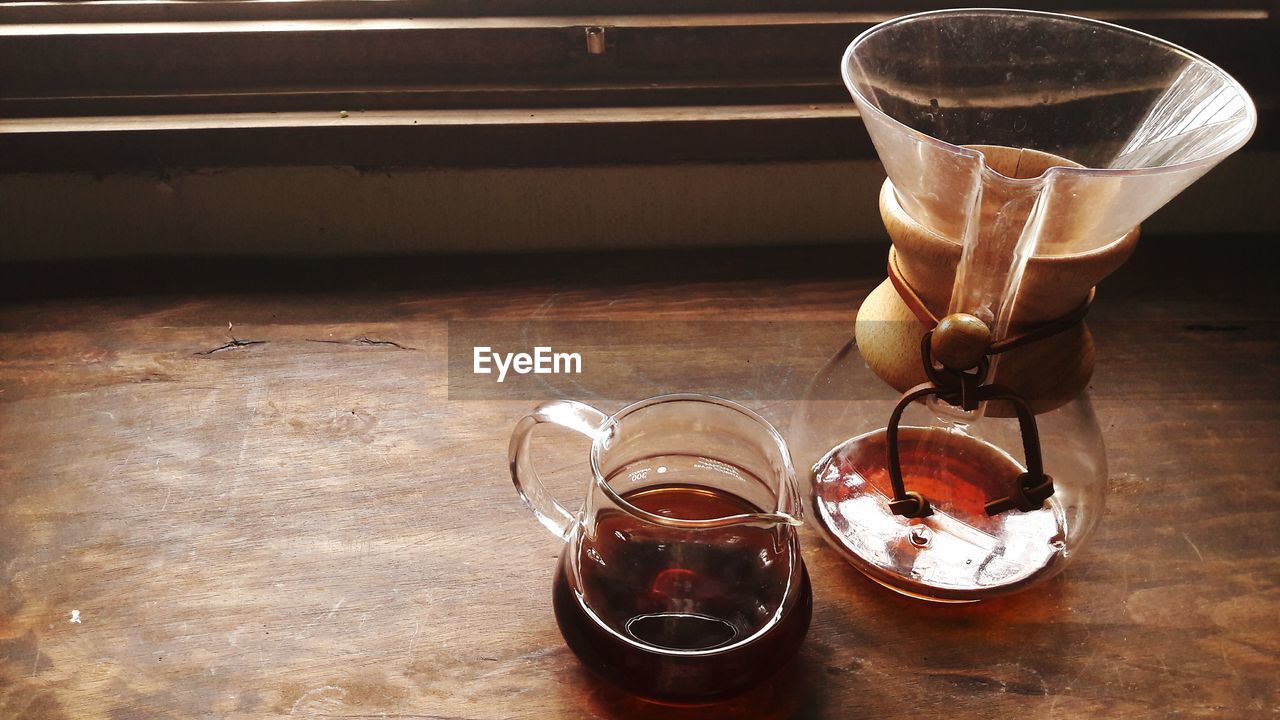 High angle view of black coffee in jar on table