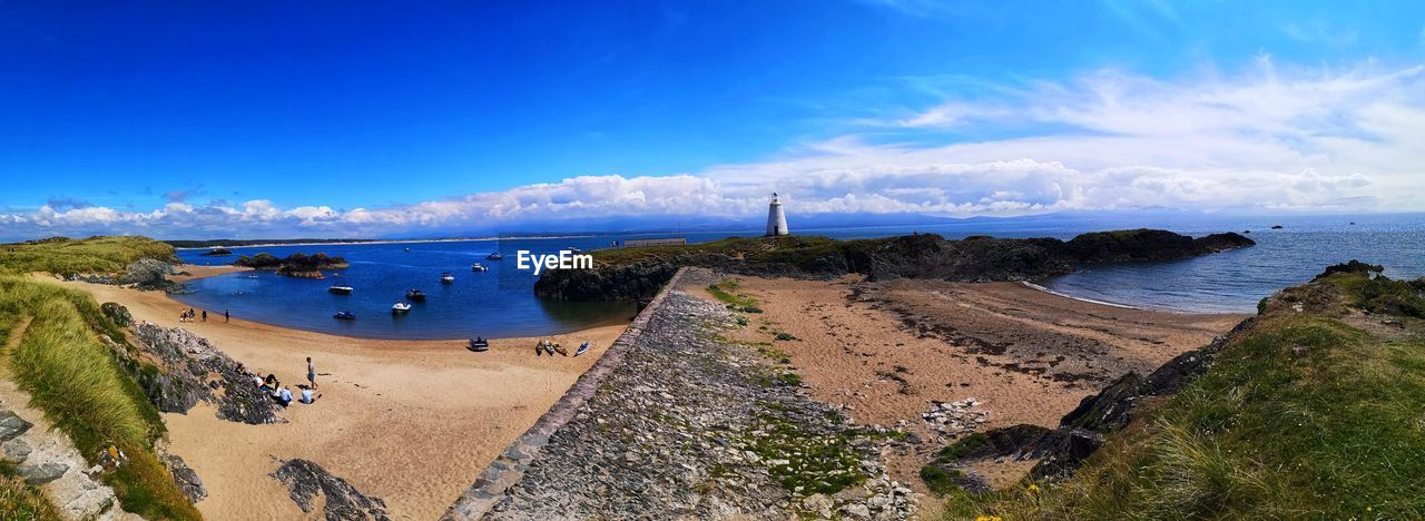 water, sea, sky, land, coast, beach, cliff, nature, panoramic, shore, scenics - nature, travel destinations, travel, landscape, blue, environment, terrain, coastline, cloud, beauty in nature, ocean, architecture, body of water, tourism, vacation, bay, cove, holiday, sand, trip, outdoors, no people, summer, tranquility, mountain, built structure, island, horizon over water, plant, horizon, bay of water, rock, seascape, day, building, city, tranquil scene, sunny, history
