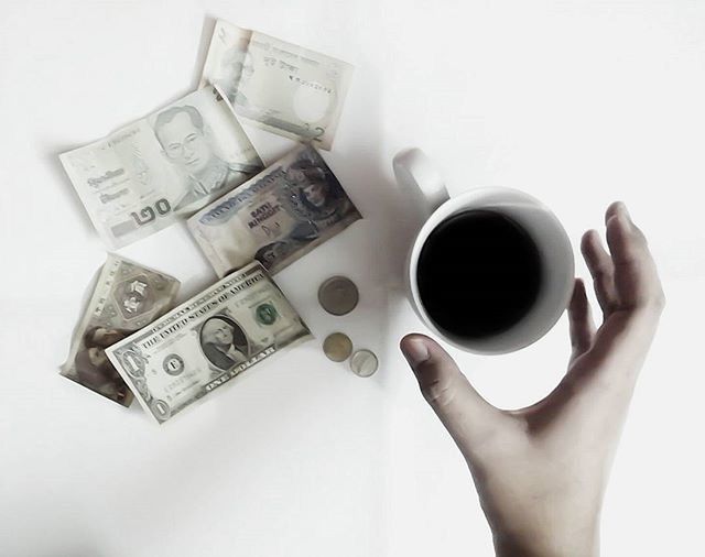 CLOSE-UP OF COFFEE CUP WITH COFFEE CUP