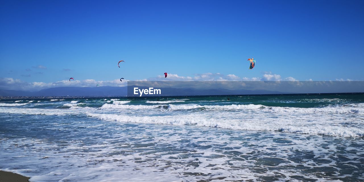 Scenic view of sea against blue sky