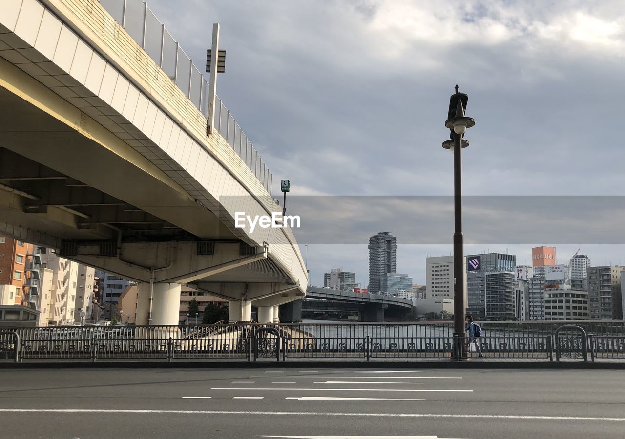 VIEW OF ELEVATED ROAD AGAINST BUILDINGS