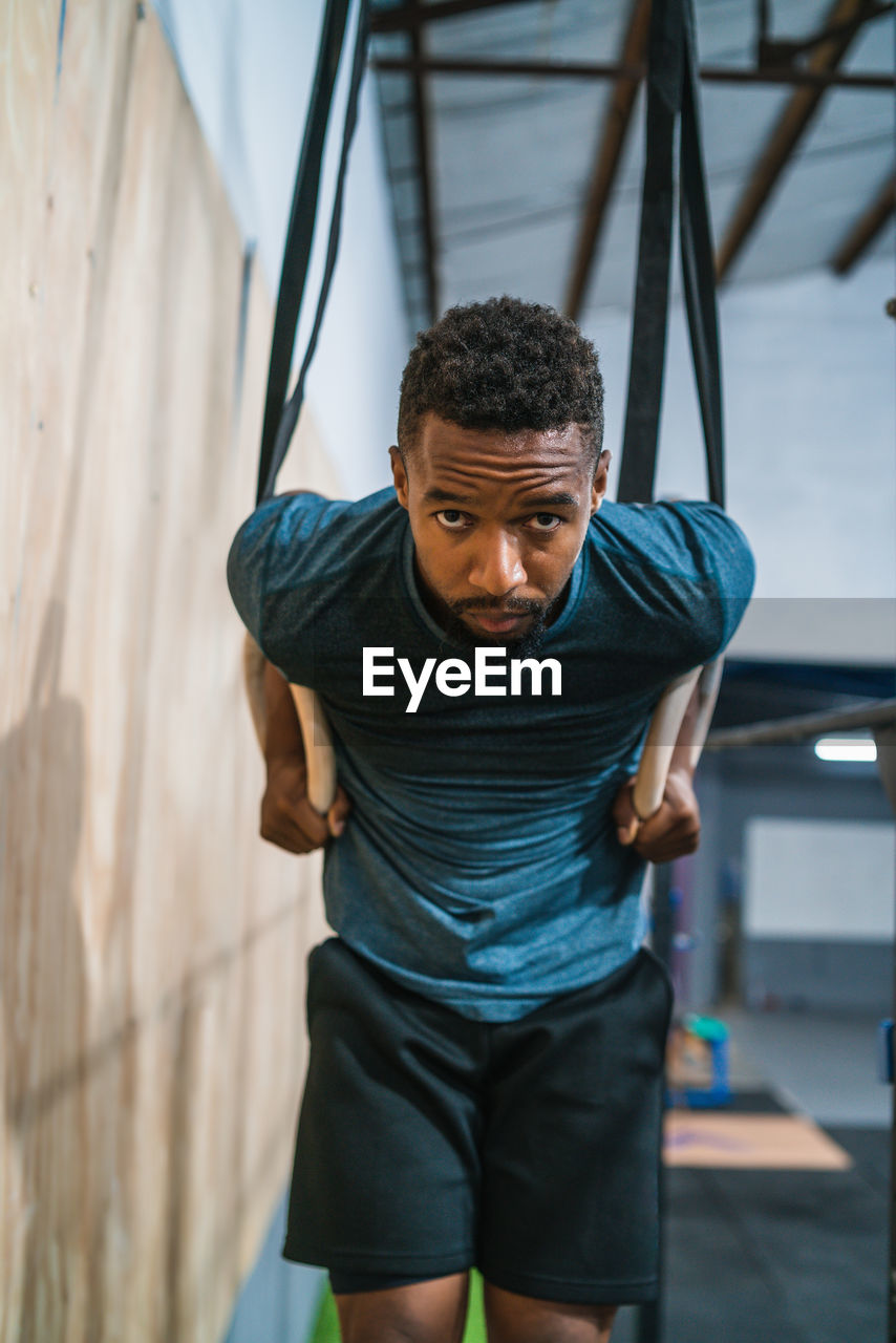 Male athlete exercising in gym