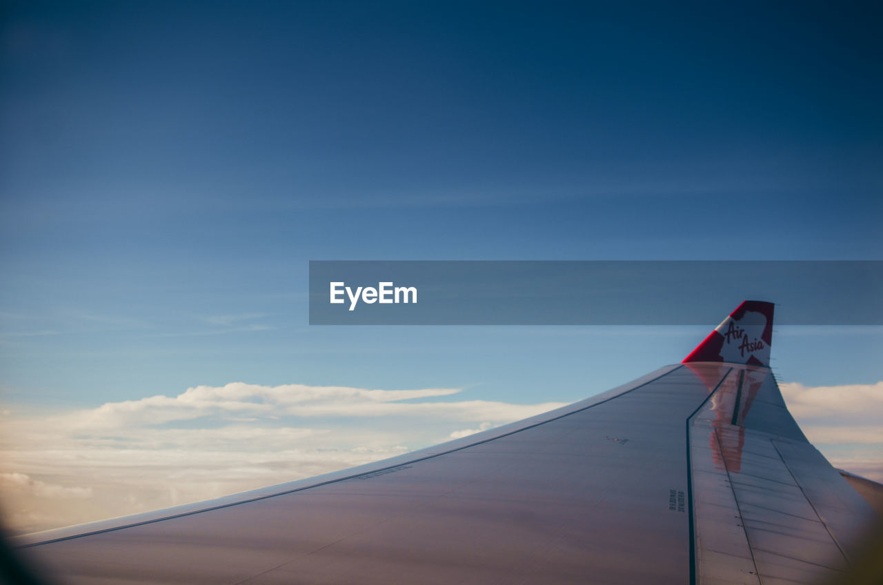 LOW ANGLE VIEW OF AIRPLANE IN SKY