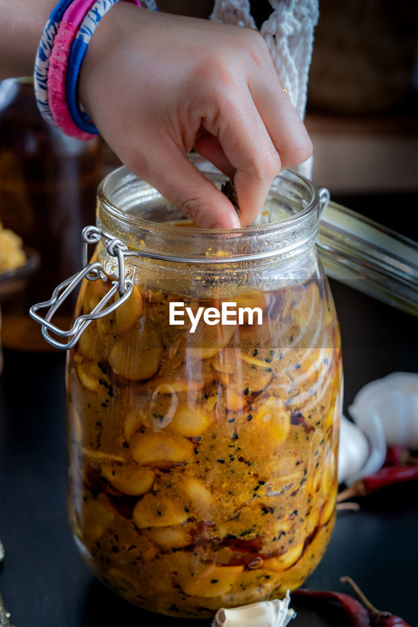 Close-up of hand holding pickle