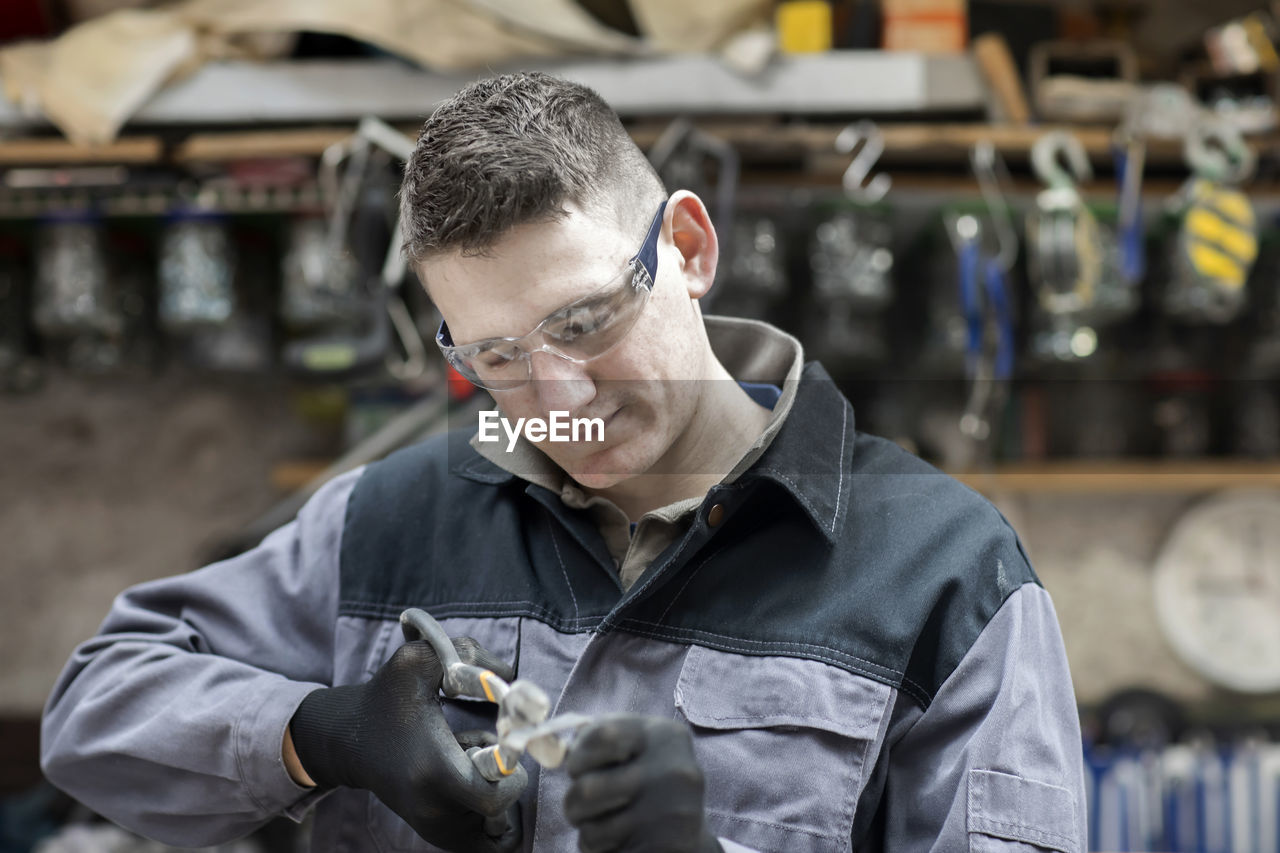 Plumber male working in a workshop