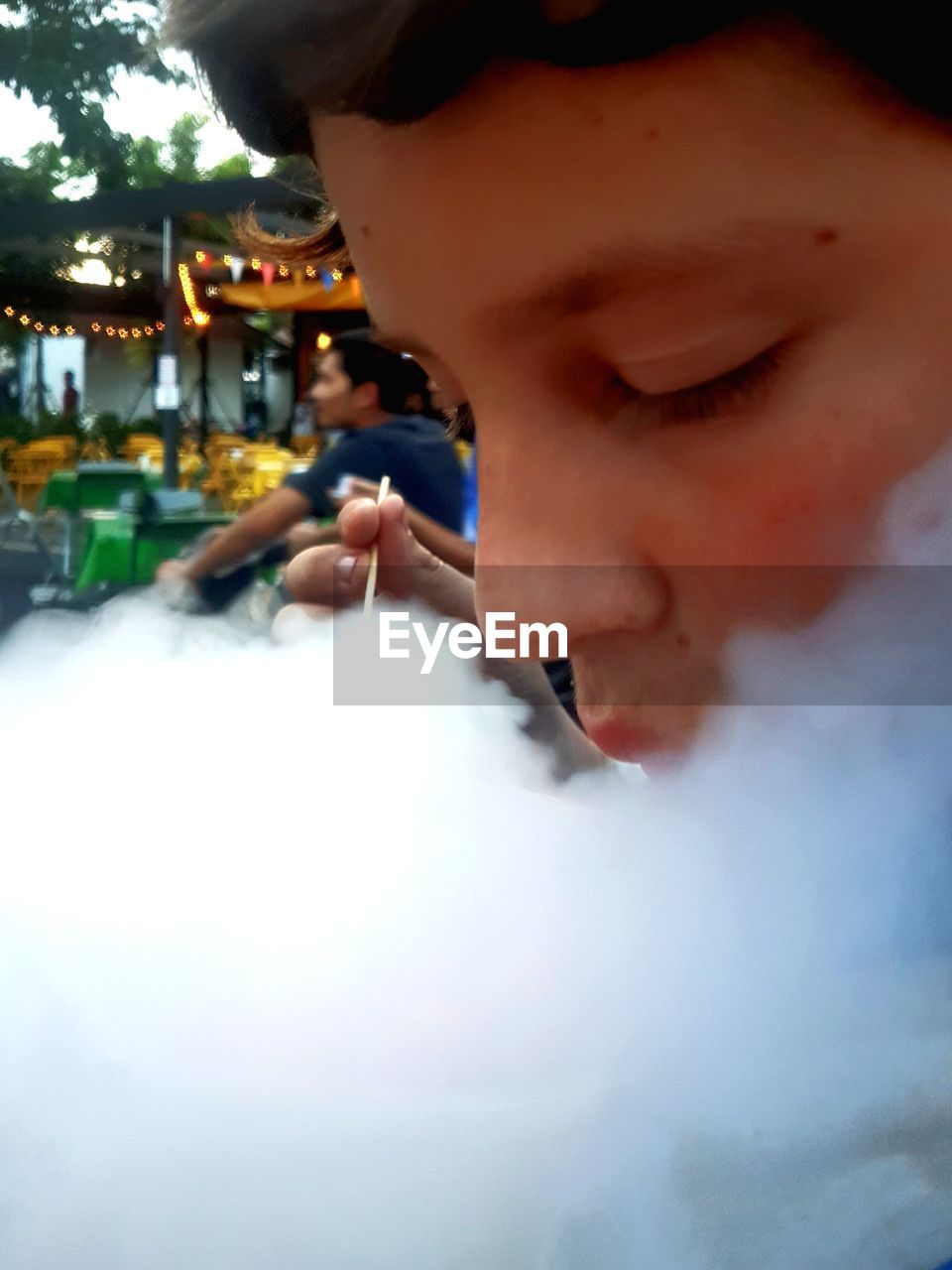 PORTRAIT OF MATURE MAN DRINKING WATER FROM SMOKING