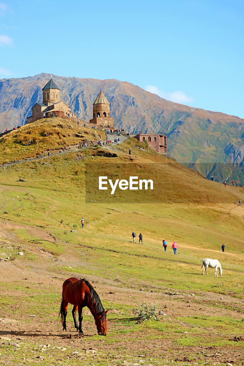 Tsminda sameba or gergeti trinity church, a popular tourist destination in kazbegi, georgia