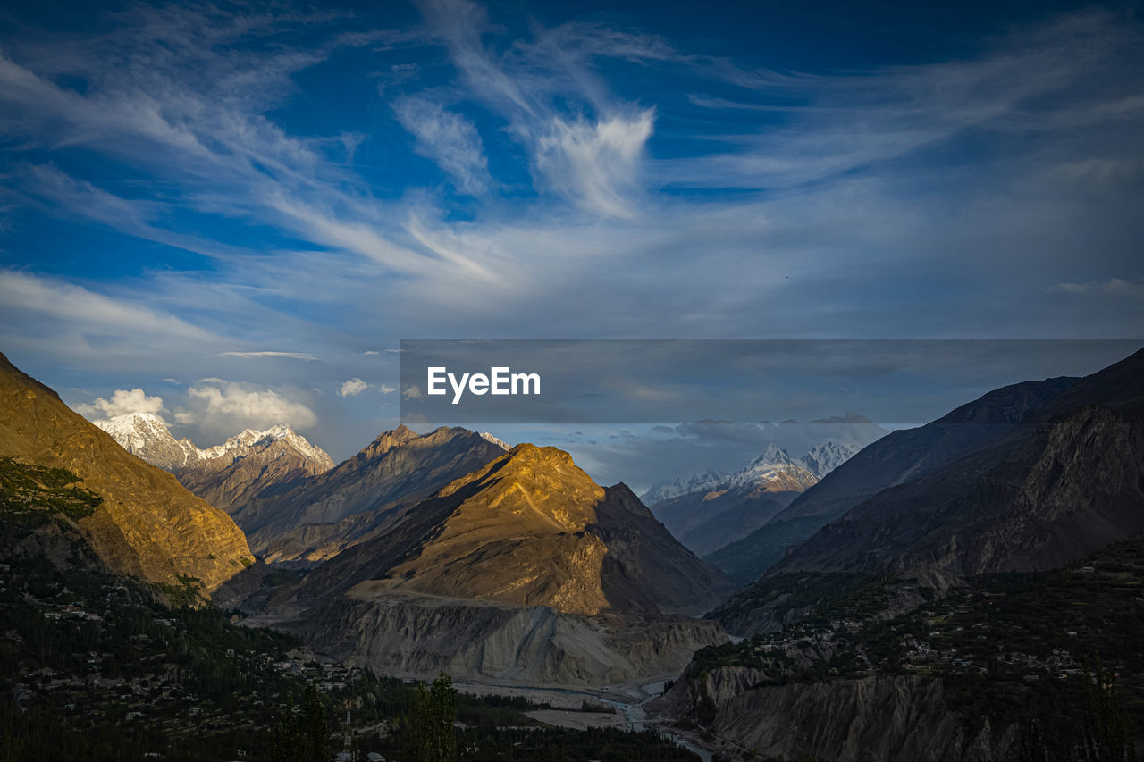 View of mountain range against cloudy sky