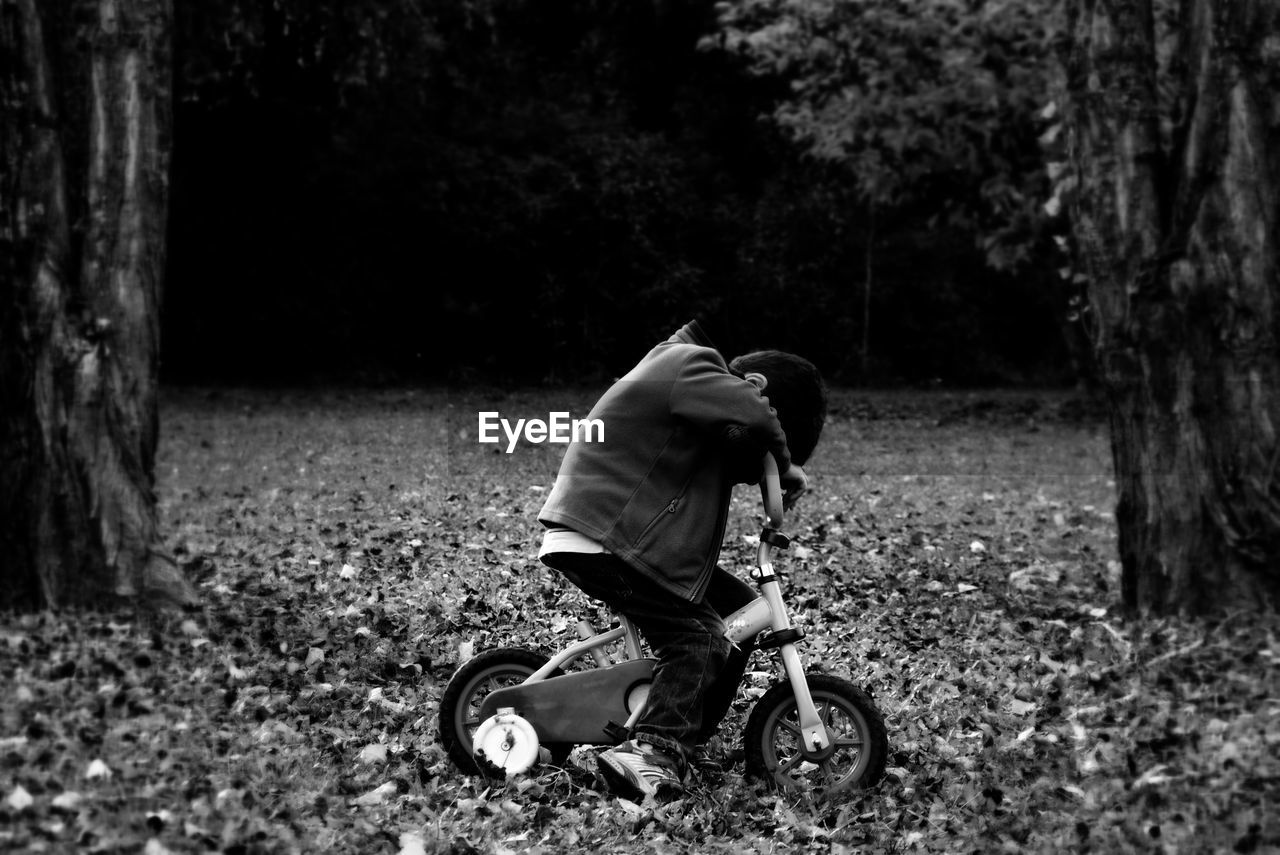 Close-up of boy on bicycle