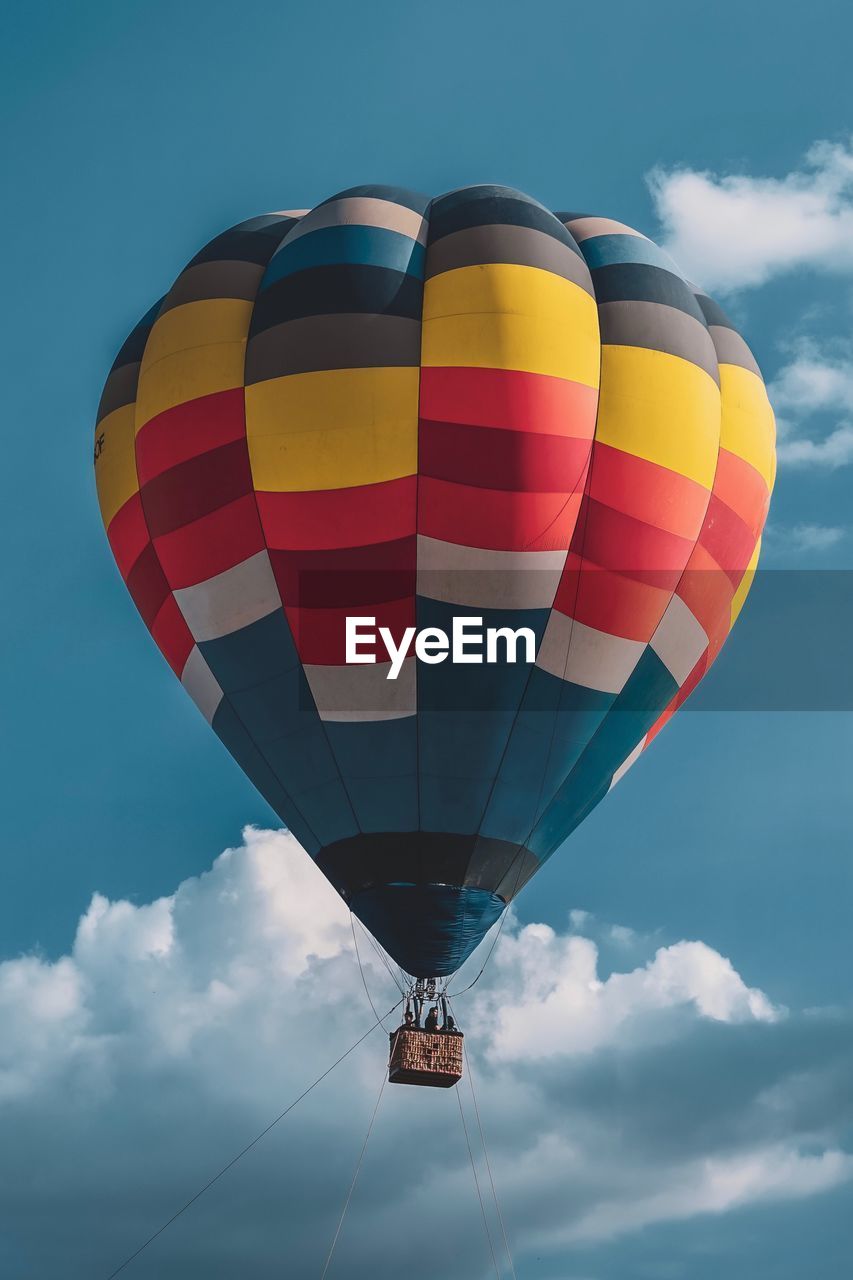 Low angle view of hot air balloon flying against sky