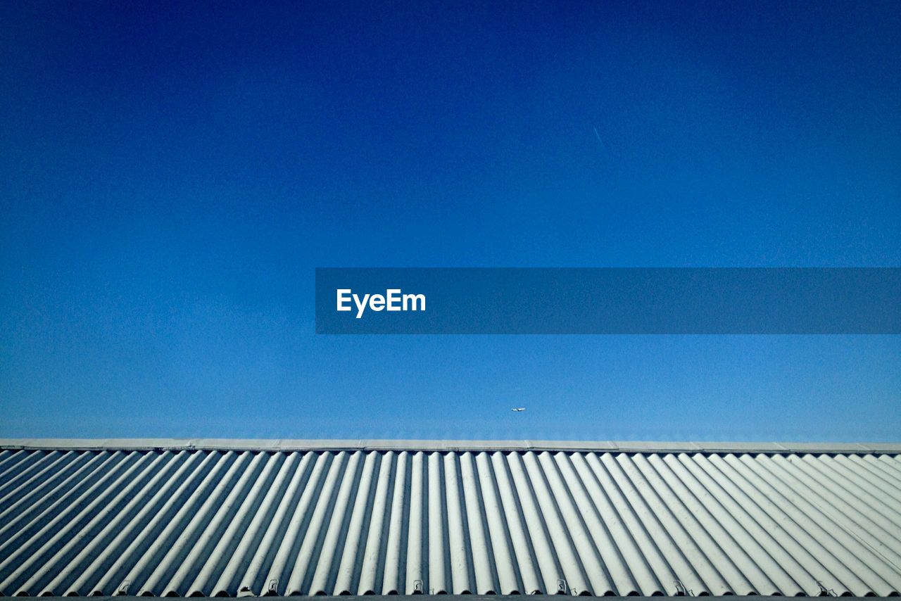 Low angle view of building against clear blue sky