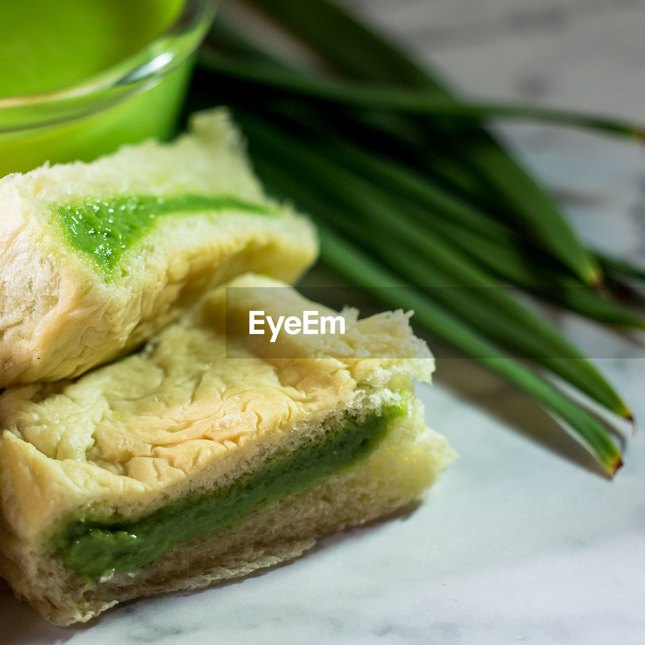 CLOSE-UP OF FRESH BREAD ON LEAVES