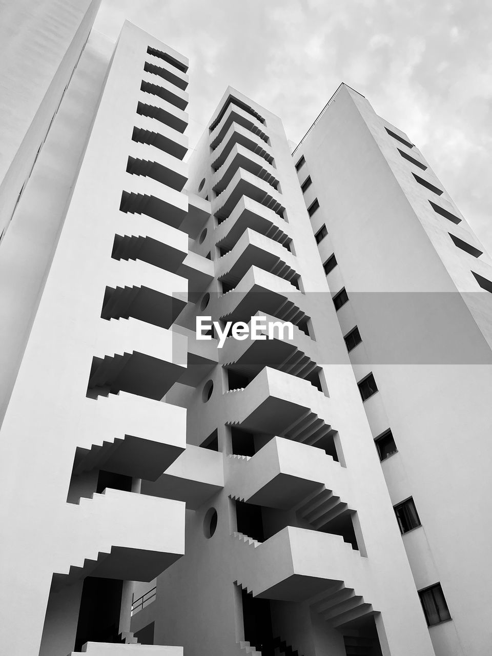 architecture, building exterior, built structure, tower block, skyscraper, building, city, black and white, sky, low angle view, monochrome, office building exterior, monochrome photography, no people, apartment, line, white, nature, office, residential district, facade, window, brutalist architecture, outdoors, business, day, pattern, tower