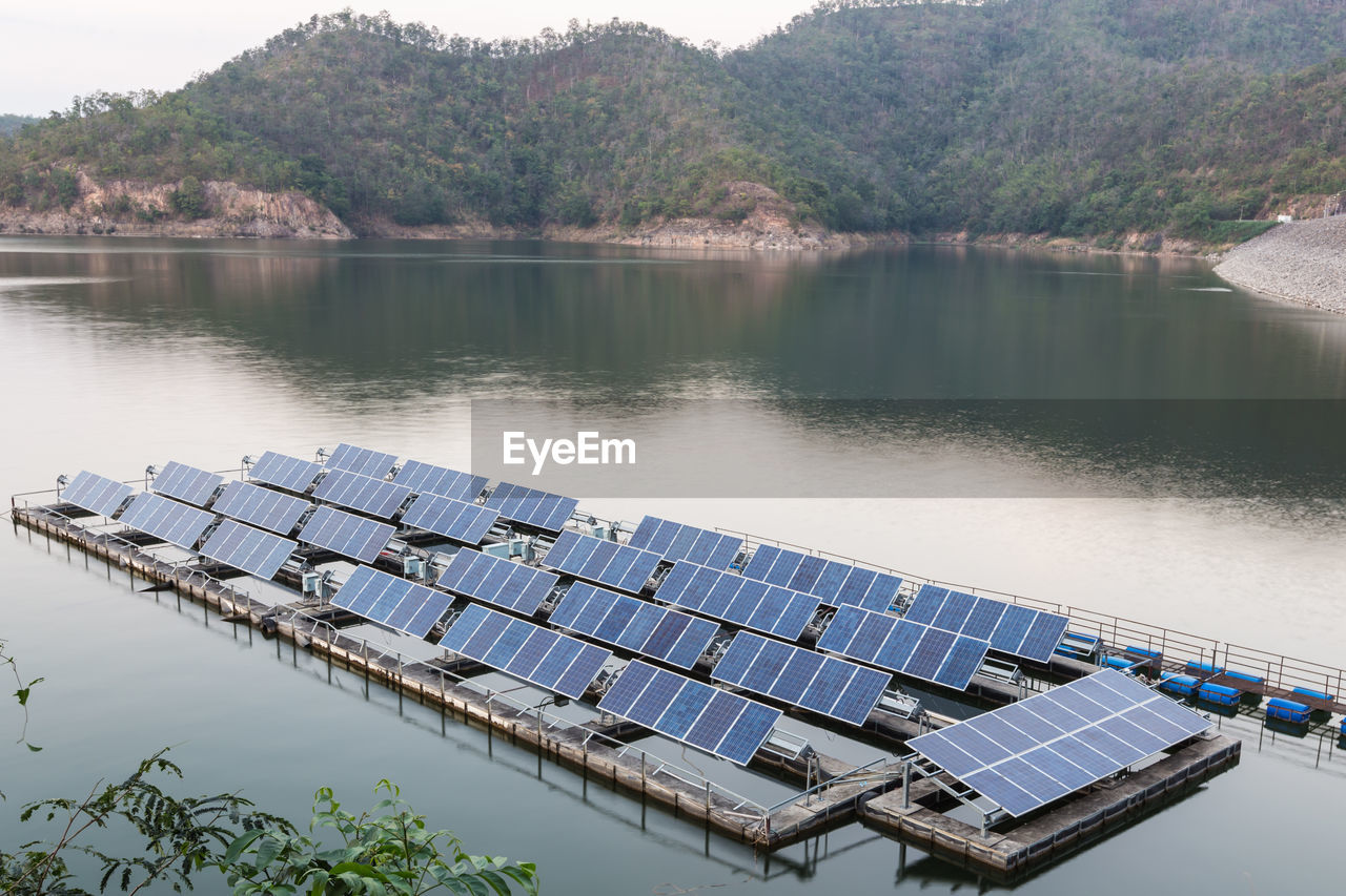 Scenic view of lake and solar panels 