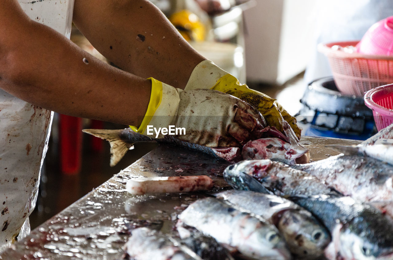 CLOSE-UP OF FISH IN CONTAINER AT MARKET