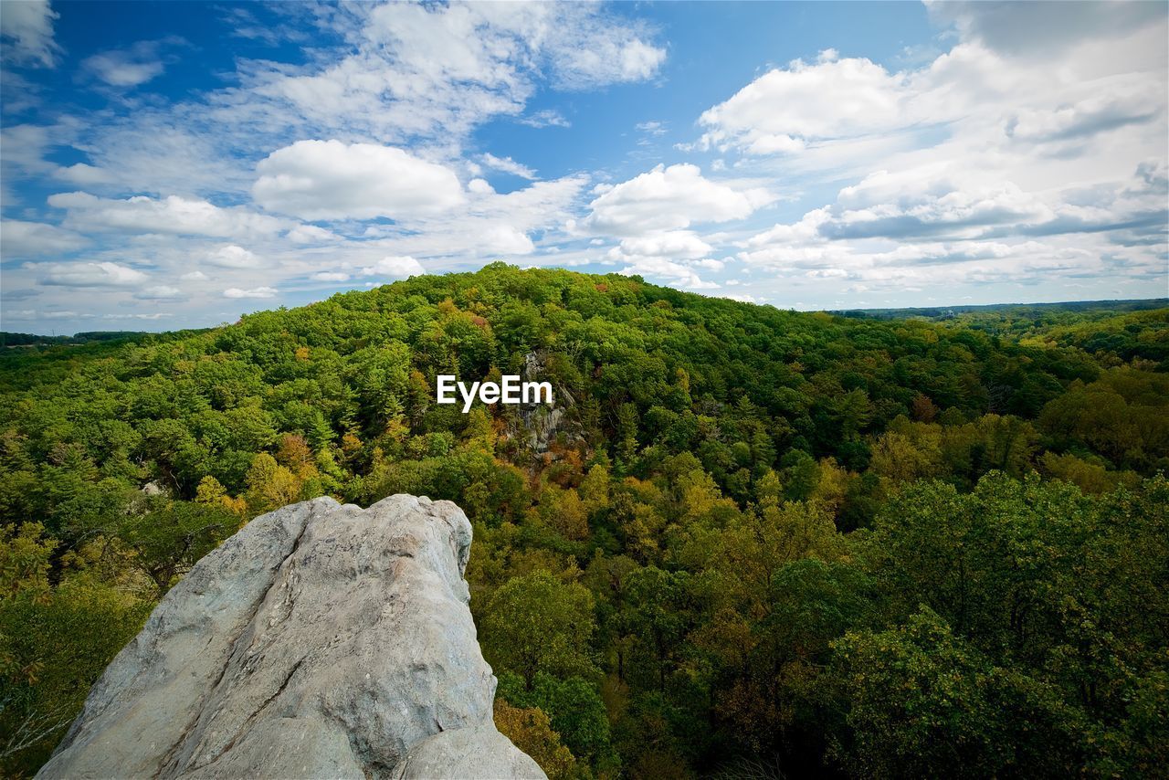 Scenic view of mountains against cloudy sky