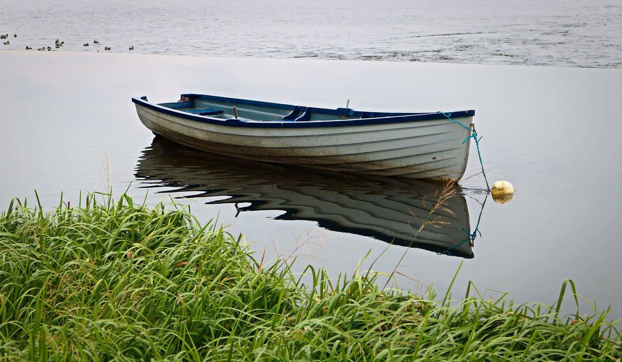 Boat moored in lake